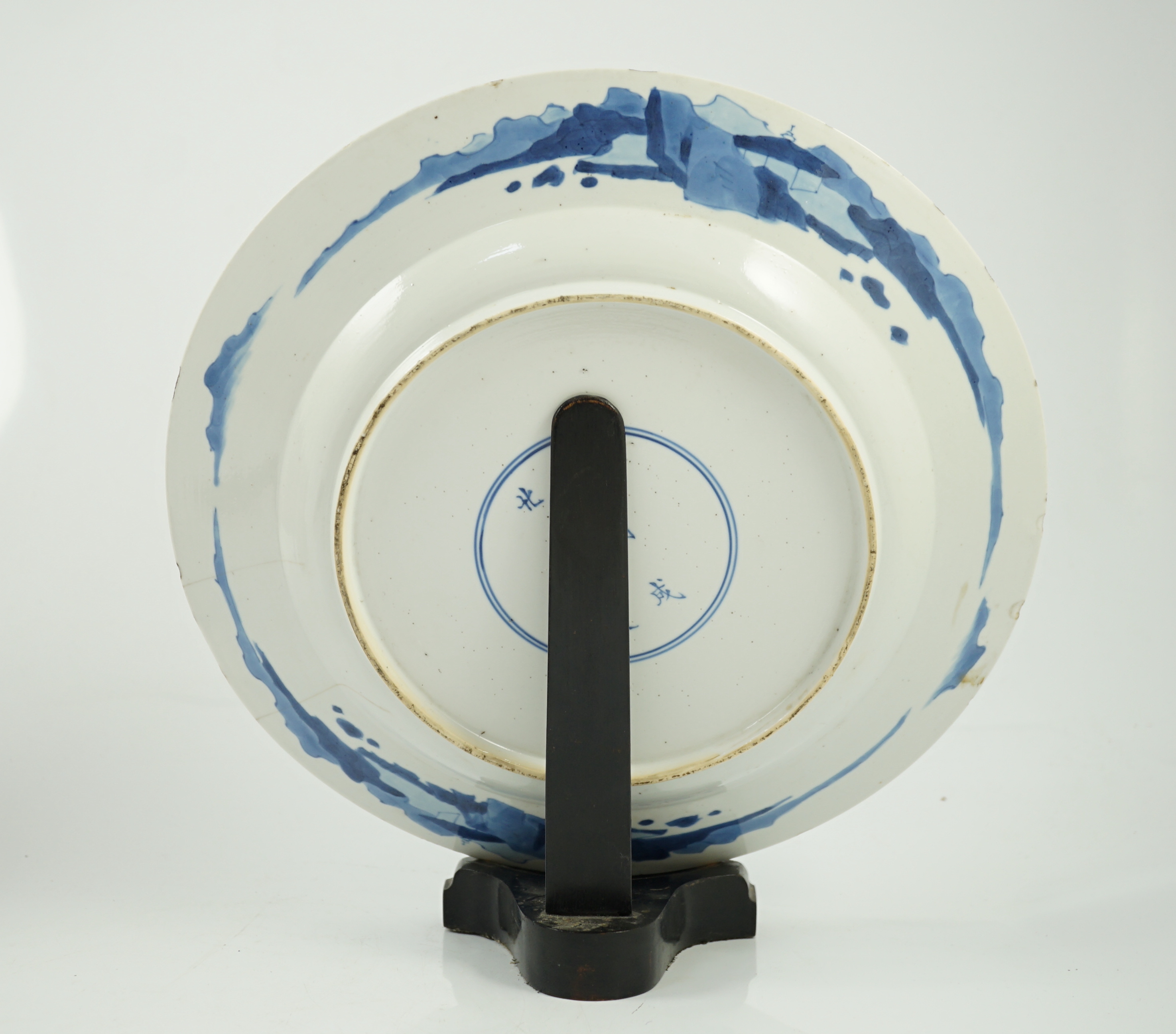 A Chinese blue and white ‘court scene’ dish, Kangxi period, two rim cracks and small splinter chips